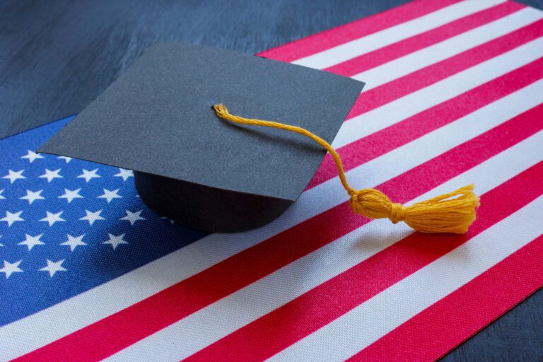 Featured image for Chapter 35 VA Benefits showing a flag of the United States and an academic cap