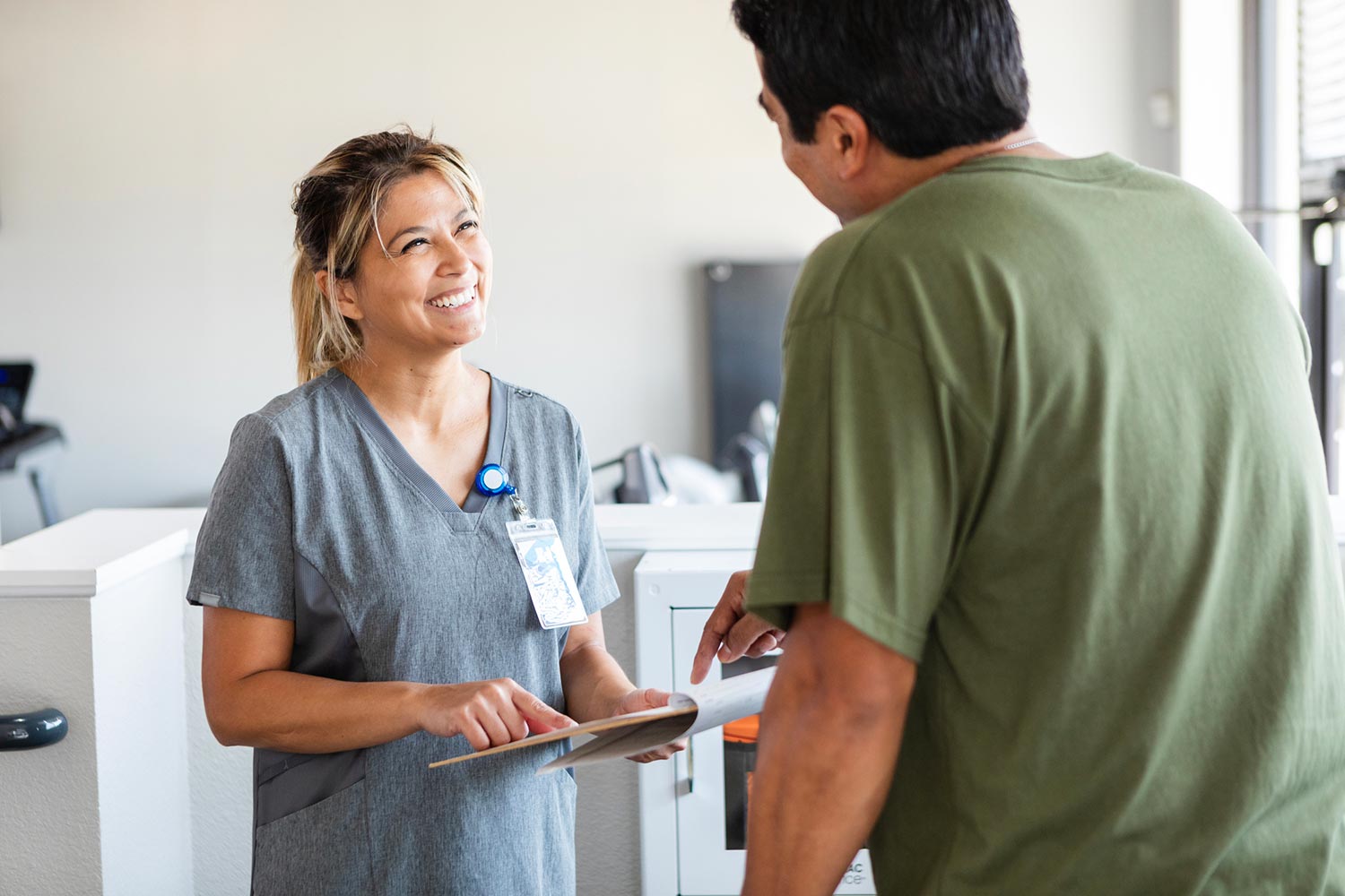 Featured image for Medicare for Veterans, showing a female occupational therapist discussing a treatment plan with a Veteran